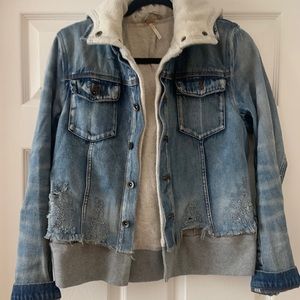 Free People denim jacket with layered sweatshirt